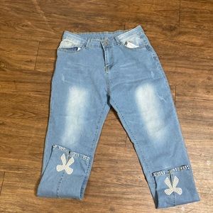 I am selling these vintage  jeans with little bows on them and rinestones!